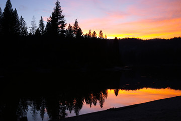 Fire at nearby Yosemite creates awesome sunset at Hume lake in Sequoia and Kings Canyon National Parks California 