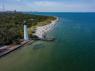 The restored Cape Florida Lighthouse on Biscayne Bay south of Miami Florida and the clear gorgeous...
