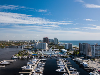 Excess and wealth expressed in large yachts docked along a waterway in Fort Lauderdale Florida