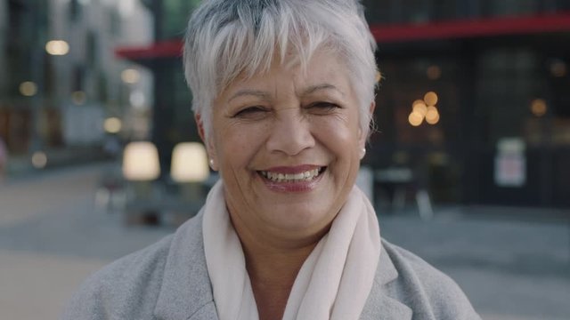 portrait of mature indian business woman smiling happy downtown