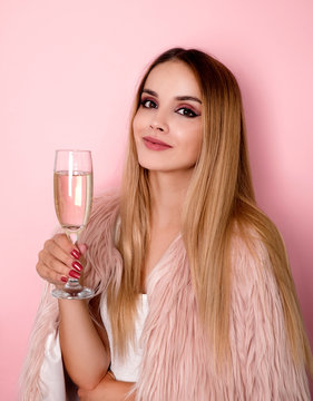 Young Woman Drinking Champagne