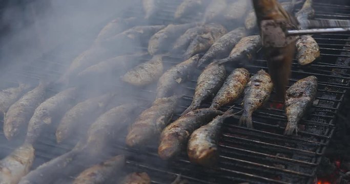 Grilled sardines on the fire