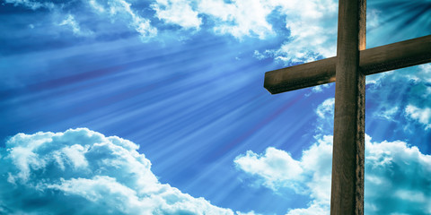 Crucifixion of Jesus Christ, wooden cross, blue sky background. 3d illustration