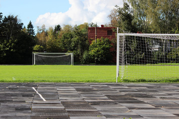 stadium: a treadmill with rubber plates and a football field with a goalkeeper's goals. Gatchina, Leningrad region