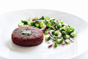 beetroot patty with cucumber, herbs, and onion salad