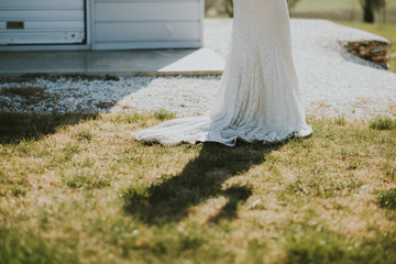 Bride in front of white building
