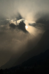 Sunburst over Rüthi; moody light as the Sun disappears in cloud over the Hoher Kasten