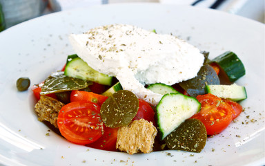Greek salad or Santorini salad in restaurant Fira Thira Greece.