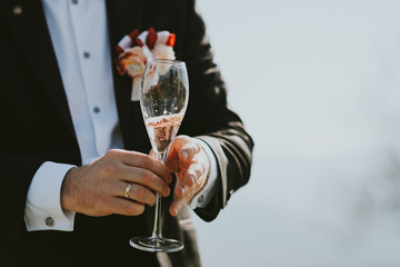Groom with glass of wine