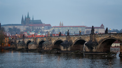 Charles bridge of Prague with foggy day and Prague castle in Czech Republic