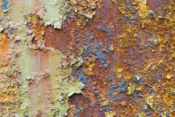 Background of rusty metal. Cracked paint on an old metallic surface.