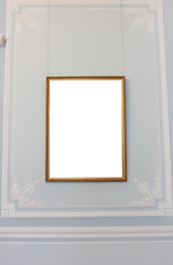 Empty Gold Border Frame with White Copy Space Isolated on Pale Blue Background. Blank Simple Template Design of Empty Golden Frame on Ornamental Museum Wall. Simple White Frame on Classic Background.