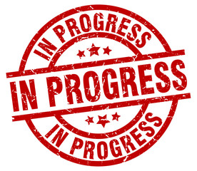 in progress round red grunge stamp