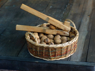Nutcracker in a basket with walnuts.