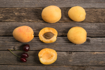 A group of apricots and cherry closeup