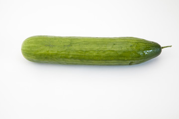 Isolated cucumber. One whole cucumber isolated on white background