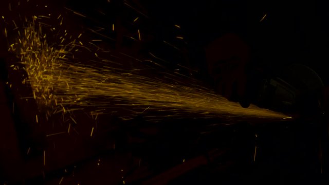 sparks effect - worker cutting iron