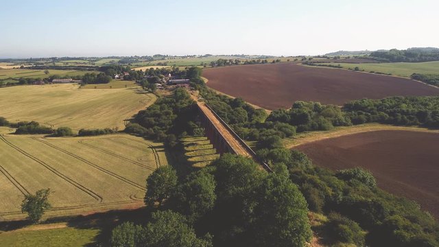 Aerial flyover going forward of a disused railway viaduct in Leicestershire, England.