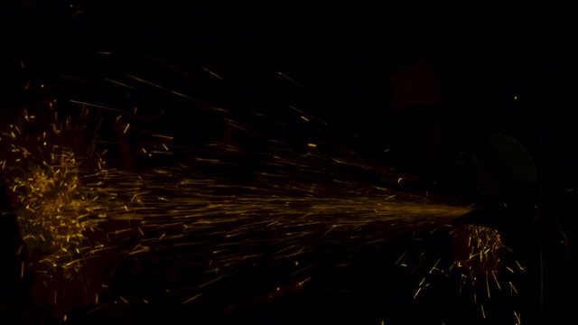 sparks effect - worker cutting iron