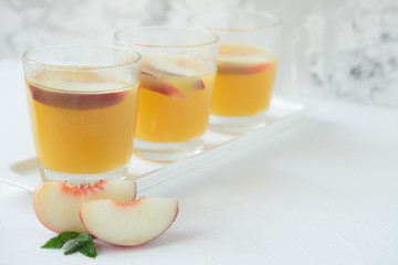 Obraz na płótnie Canvas Nectarine juice with slices