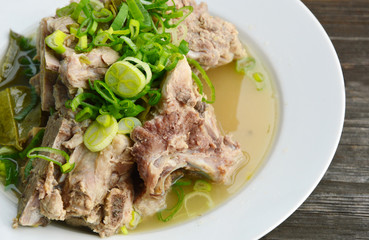 hot and spicy pork bone hot pot with lime and Thai herbs.(Thai name is Tom saep or Tom yum kraduk moo)..Pork bone menu.