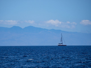 Fototapeta premium Boat off the coat at Los Cristianos resort in Tenerife, Canary Islands, Spain