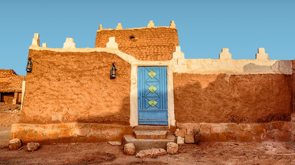 Old Arabic House with Door and Antique Lanterns - Traditional Arab Mud Architecture - Part of an...