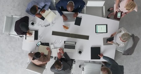 time lapse diverse marketing research team brainstorming ideas on successful business solution planning strategy using colorful note paper in modern boardroom top view rotate - Powered by Adobe
