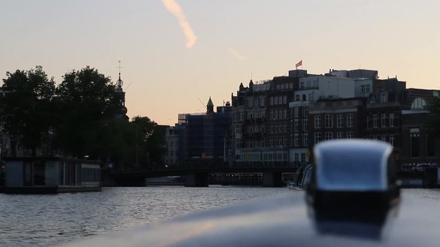 Being on a boat tour, through Amsterdam in the afternoon.