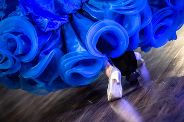 Legs of young dancers on the dance floor