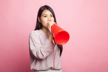 Beautiful young Asian woman announce with megaphone.