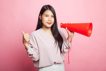 Beautiful young Asian woman show thumbs up announce with megaphone.