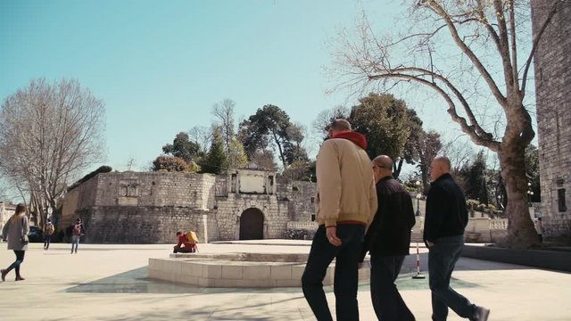 Caucasian people walking through Zadar city. Croatia. Slow Motion.