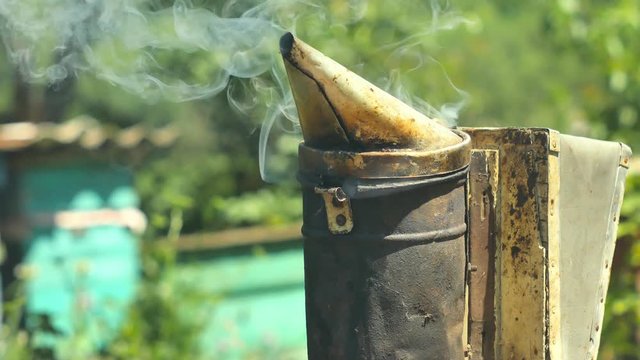 Bee maker of a smoke pipe beeper smoker device for repelling evil bees.