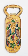 old bronze bottle opener on isolated background antiques