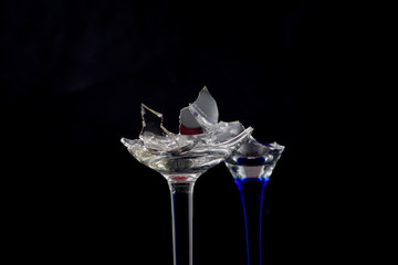 Broken glass in front of black background photographed under the name glass shards cocktail
