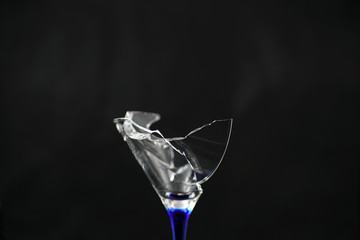 Broken glass in front of black background photographed under the name glass shards cocktail
