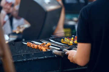 Cooking Meat On Grill Outdoors Closeup. Barbecue