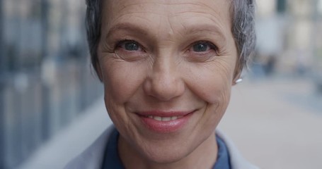 close up portrait happy mature business woman smiling enjoying successful urban lifestyle in city slow motion aging beauty - Powered by Adobe