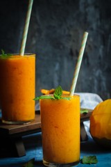 Mango Peach frozen drink or smoothieserved in tall glass, selective focus
