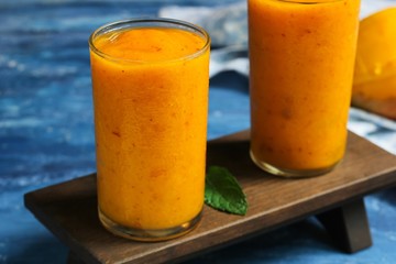 Mango Peach frozen drink or smoothieserved in tall glass, selective focus