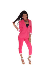 Fototapeta premium Portrait of a lovely African woman pulling her hair