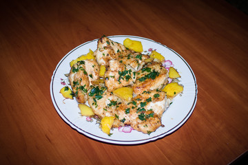 sliced chicken breasts with lemon and parsley