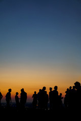 Fototapeta na wymiar People in sunset