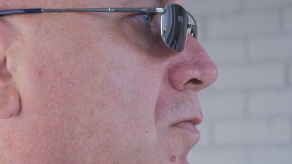 Close Up Image with a Confident Businessman Wearing Sunglasses