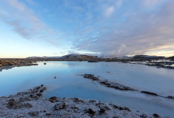 Fototapeta na wymiar The blue lagoon in Iceland. The blue water between the lava stones at winter.