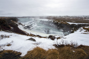 Golden waterfall Gullfoss view in the canyon of the Hvita river in winter, Iceland. Winter scenic view.