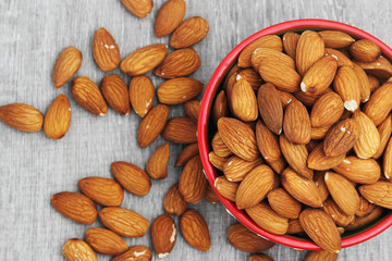 A ceramic bowl full of almonds
