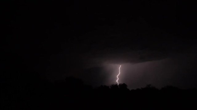 Bolts of lightning during a storm at night