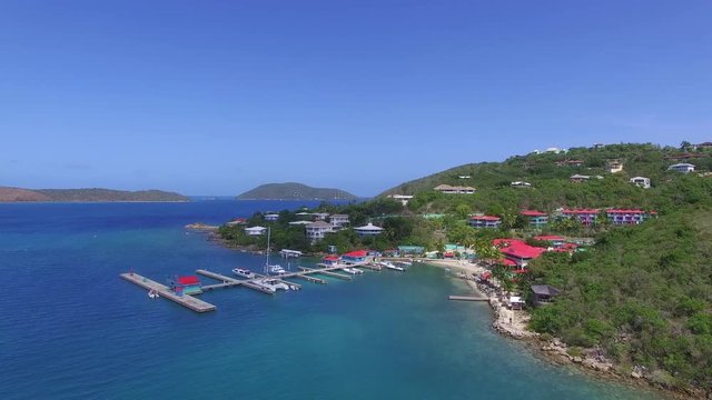 This is a coast shot of British Virgin Islands where you can see the pier and some apartments in the background. This is shot with a drone p4.